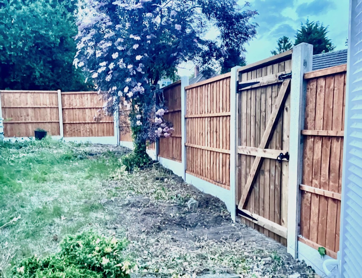 Featheredge fence run with a matching timber gate