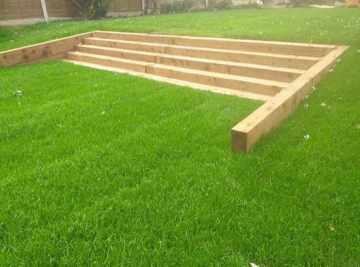 New railway-sleeper garden steps set into a fresh lawn